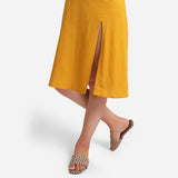 Left Detail of a Model wearing Mustard Cotton Flax Strappy Slit Dress