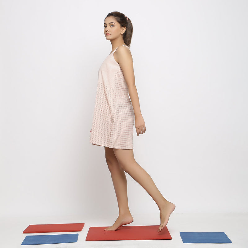 Left View of a Model wearing Ecru and Red Vegetable Dyed Handspun Cotton Short Dress