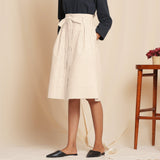 Left View of a Model wearing Striped Beige Paperbag Button-Down Cotton Skirt