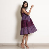Right View of a Model wearing Berry Wine Striped Cotton Knee Length Tier Dress