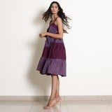 Left View of a Model wearing Berry Wine Striped Cotton Knee Length Tier Dress