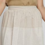 Front Detail of a Model wearing Striped Pleated High-Rise Paneled Skirt