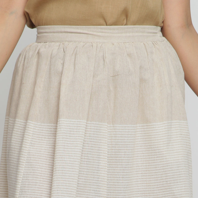 Front Detail of a Model wearing Striped Pleated High-Rise Paneled Skirt