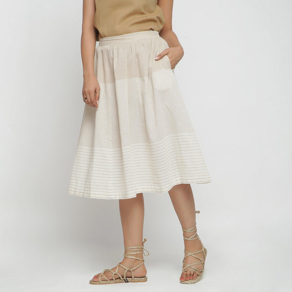 Left View of a Model wearing Striped Pleated High Rise Paneled Skirt