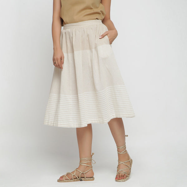 Left View of a Model wearing Striped Pleated High-Rise Paneled Skirt