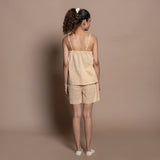 Back View of a Model wearing Sunset Orange Block Print Cotton Camisole Top