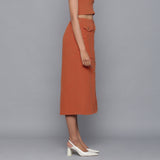 Right View of a Model wearing Sunset Rust Button-Down Midi Skirt