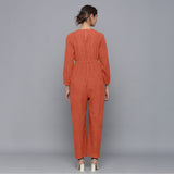 Back View of a Model wearing Sunset Rust Corduroy Comfy Jumpsuit