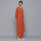 Right View of a Model wearing Sunset Rust Corduroy Comfy Jumpsuit