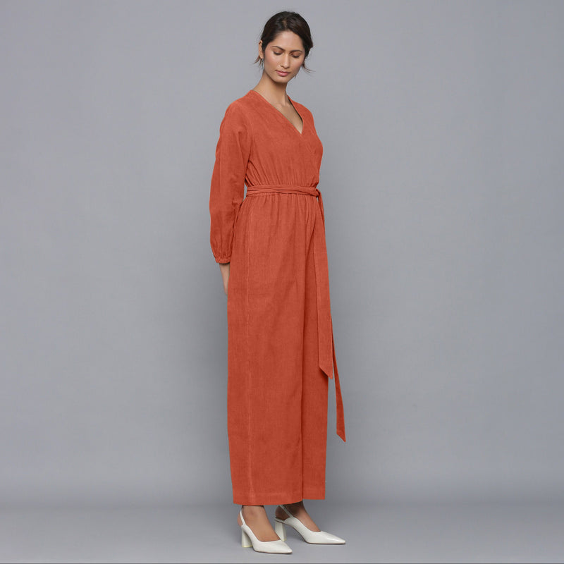 Right View of a Model wearing Sunset Rust Corduroy Comfy Jumpsuit