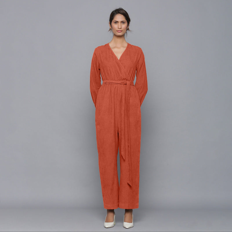 Front View of a Model wearing Sunset Rust Corduroy Comfy Jumpsuit