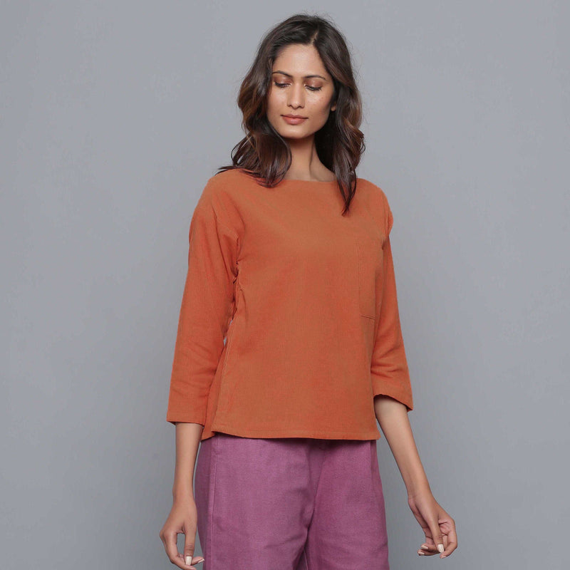 Front View of a Model wearing Sunset Rust Corduroy Drop Shoulder Top