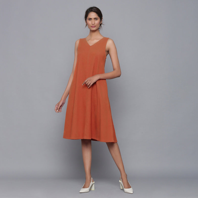 Front View of a Model wearing Sunset Rust Corduroy Flared Dress