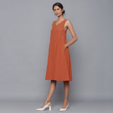 Left View of a Model wearing Sunset Rust Corduroy Flared Dress