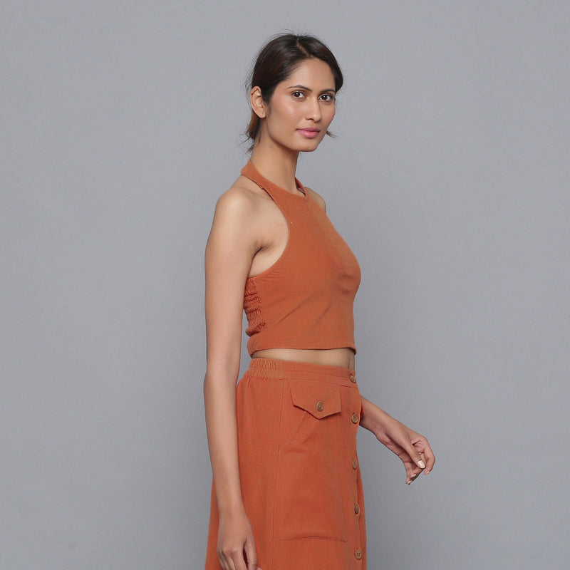 Right View of a Model wearing Sunset Rust Corduroy Halter Neck Top