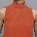 Front Detail of a Model wearing Sunset Rust Cotton Corduroy High Neck Top