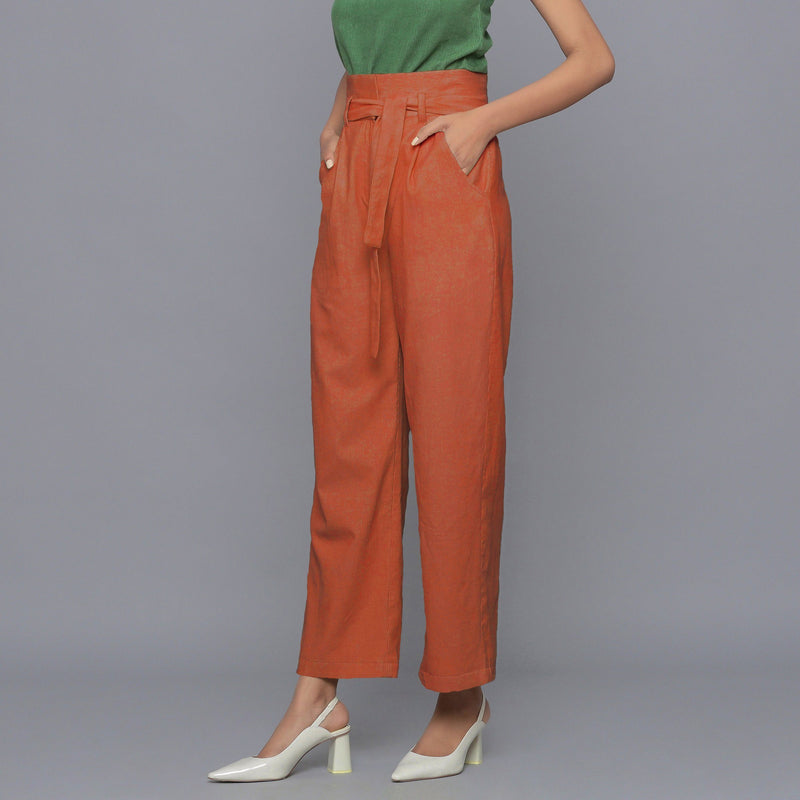Left View of a Model wearing Sunset Rust Cotton Corduroy Pant