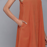 Front Detail of a Model wearing Sunset Rust Corduroy Flared Dress