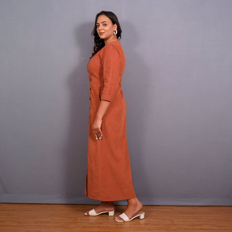 Left View of a Model wearing Sunset Rust Warm Cotton Corduroy Front Slit Maxi Dress