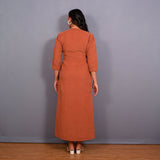 Back View of a Model wearing Sunset Rust Warm Cotton Corduroy Front Slit Maxi Dress