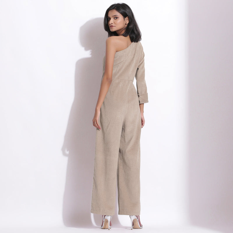 Back View of a Model wearing Taupe Beige Corduroy One-Shoulder Jumpsuit