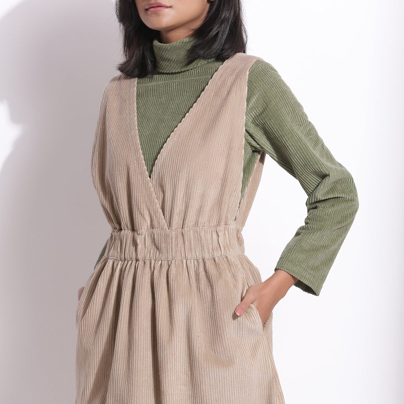 Front Detail of a Model wearing Taupe Beige Warm Cotton Corduroy Pinafore Midi Dress