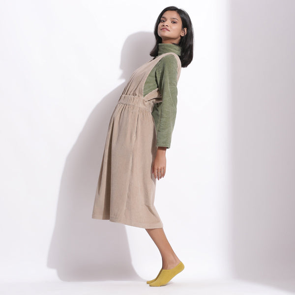 Left View of a Model wearing Taupe Beige Warm Cotton Corduroy Pinafore Midi Dress