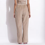 Back View of a Model wearing Taupe Beige Corduroy Wide-Legged Trouser Pant