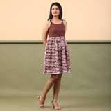 Right View of a Model wearing Taupe Shibori Tie-Dye Cotton Gathered Short Dress