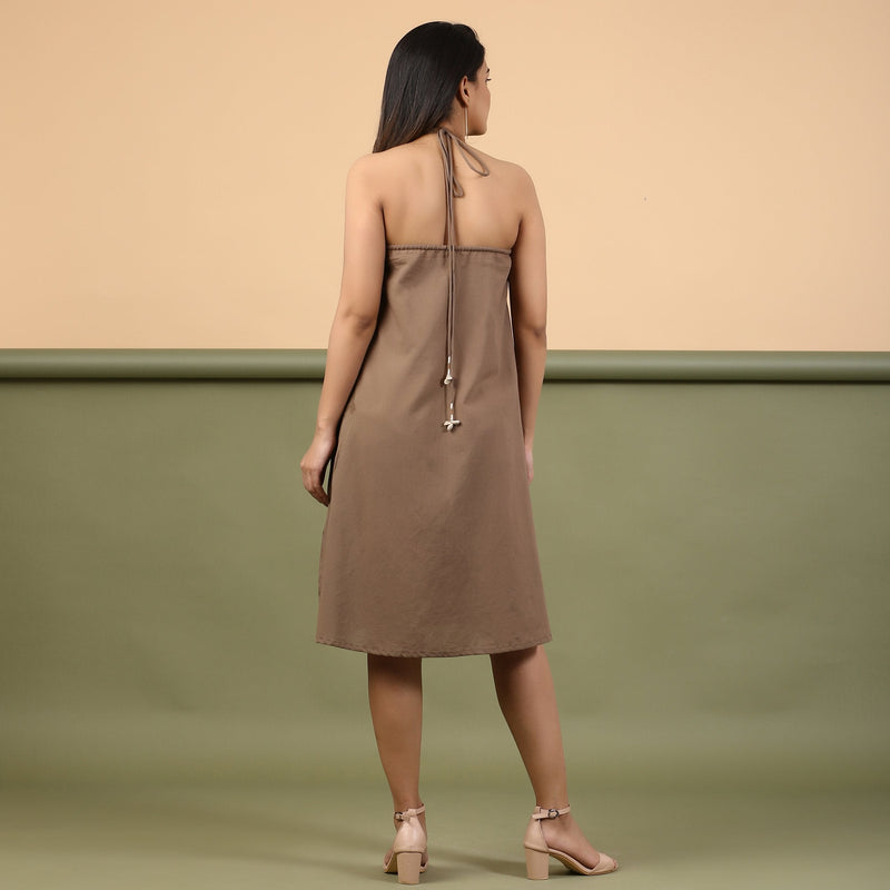 Back View of a Model wearing Taupe Tie-Dye Cotton Knee Length Halter Neck Dress