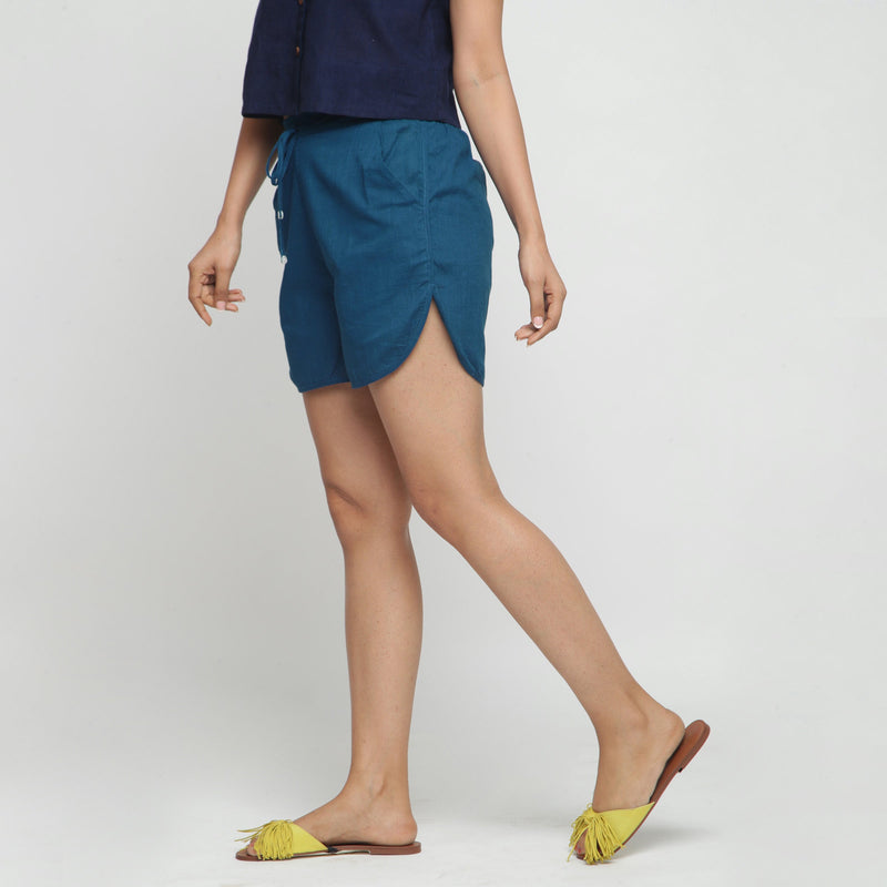 Left View of a Model wearing Teal Blue Low Rise Short Cotton Shorts