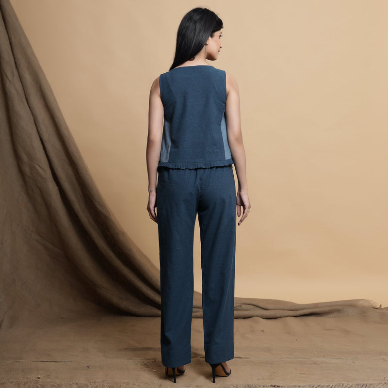 Back View of a Model wearing Teal Blue Panelled Top and Pant Set