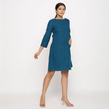 Right View of a Model wearing Teal Blue Yoked Cotton Tunic Dress