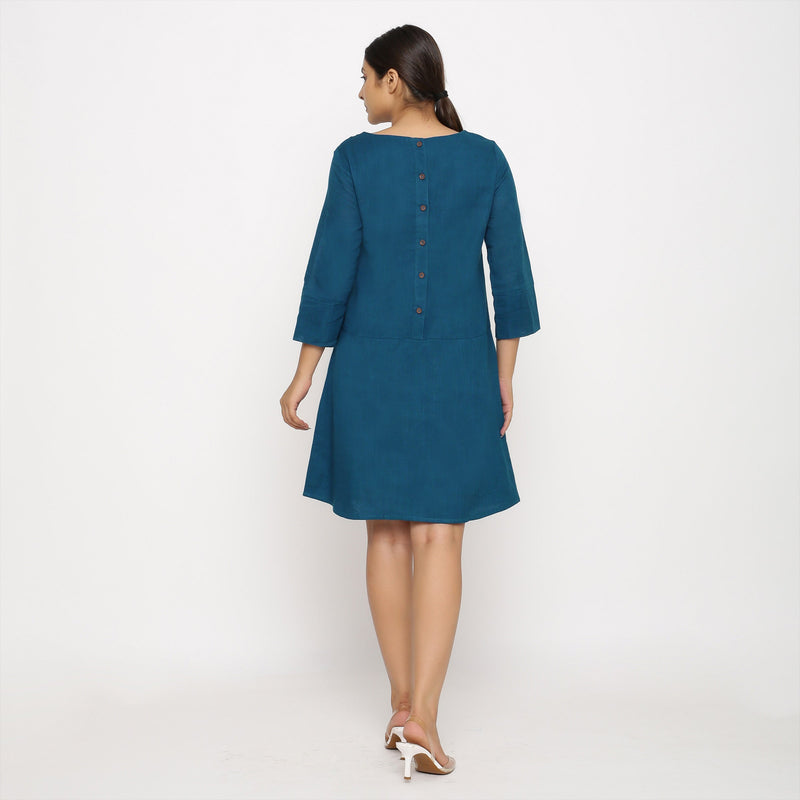 Back View of a Model wearing Teal Blue Yoked Cotton Tunic Dress