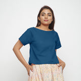 Front View of a Model wearing Teal Boat Neck Half Sleeve Cotton Top