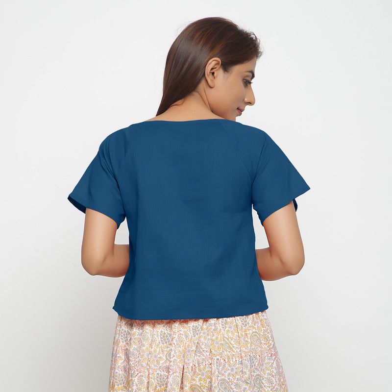 Back View of a Model wearing Teal Boat Neck Half Sleeve Cotton Top