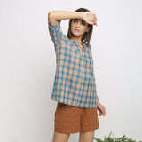 Right View of a Model wearing Green and Brown Checkered Tunic Top