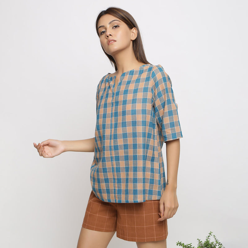 Left View of a Model wearing Green and Brown Checkered Tunic Top