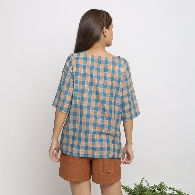 Back View of a Model wearing Green and Brown Checkered Tunic Top