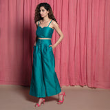 Left View of a Model wearing Teal Chanderi High Rise Wide Legged Pants