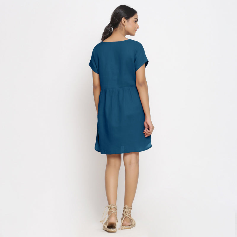 Back View of a Model wearing Teal Cotton Solid Wrap Dress