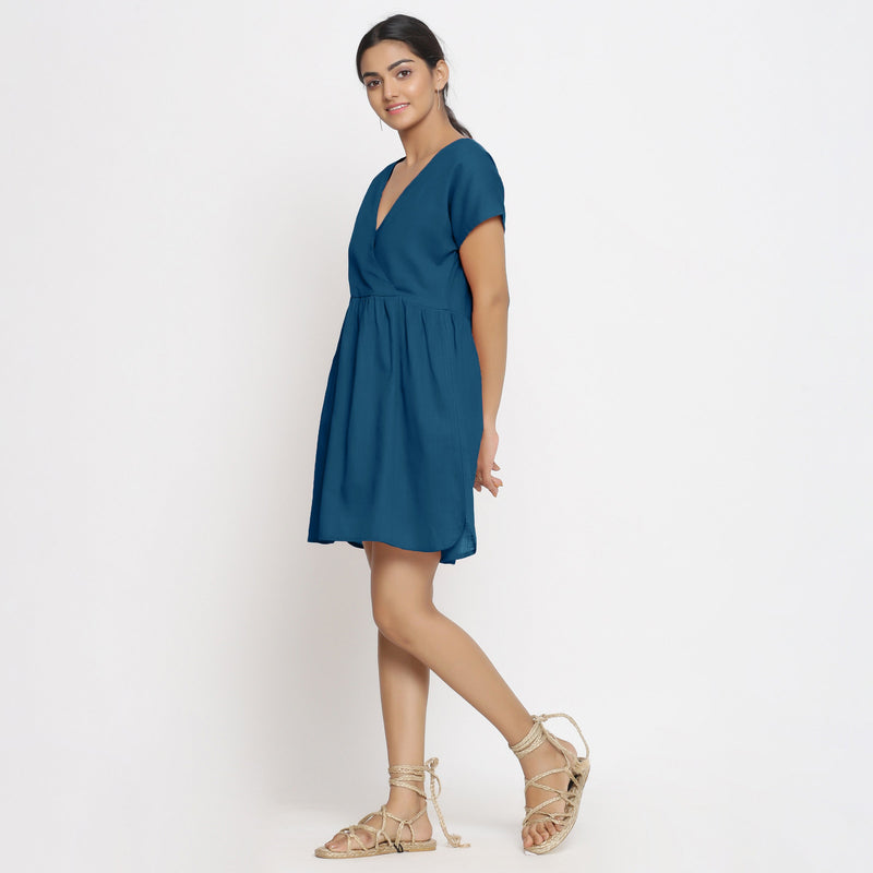 Left View of a Model wearing Teal Cotton Solid Wrap Dress