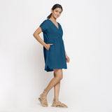 Right View of a Model wearing Teal Cotton Solid Wrap Dress