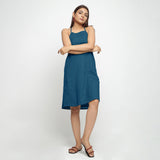 Front View of a Model wearing Teal Criss-Cross Cotton A-Line Dress