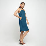 Right View of a Model wearing Teal Criss-Cross Cotton A-Line Dress