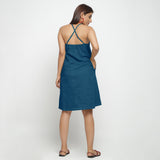 Back View of a Model wearing Teal Criss-Cross Cotton A-Line Dress