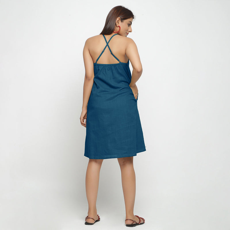 Back View of a Model wearing Teal Criss-Cross Cotton A-Line Dress