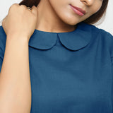 Front Detail of a Model wearing Teal Everyday Essential A-Line Top