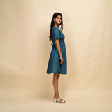 Right View of a Model wearing Teal 100% Cotton Blouson Dress