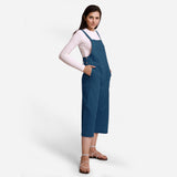 Right View of a Model wearing Teal Pinafore Midi Length Dungaree